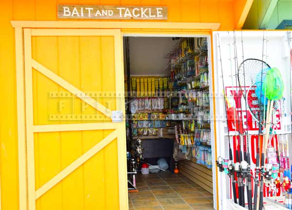 Bright yellow fishing gear store at Gardners basin waterfront