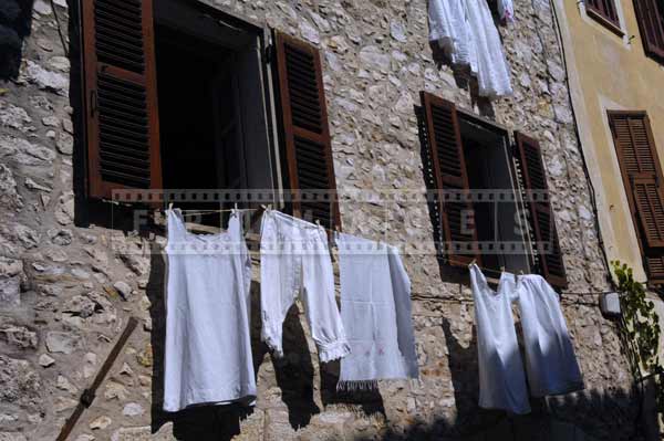 White laundry drying in the window, Provence travel images
