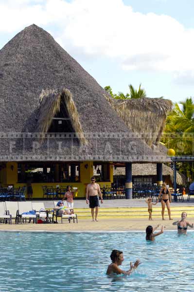 Caribbean beach scenes with palapa buildings