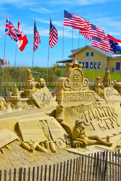 sand castle competition 2014 atlantic cty display with flags near boardwalk