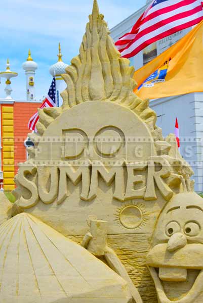 Sand castle competition logo saying : DO SUMMER, near Taj Mahal Hotel and Casino