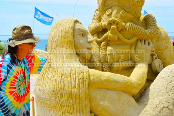 Atlantic city beach sand artist Damon Farmer working on his sand sculpture