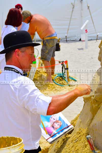 Sand artist sculpting