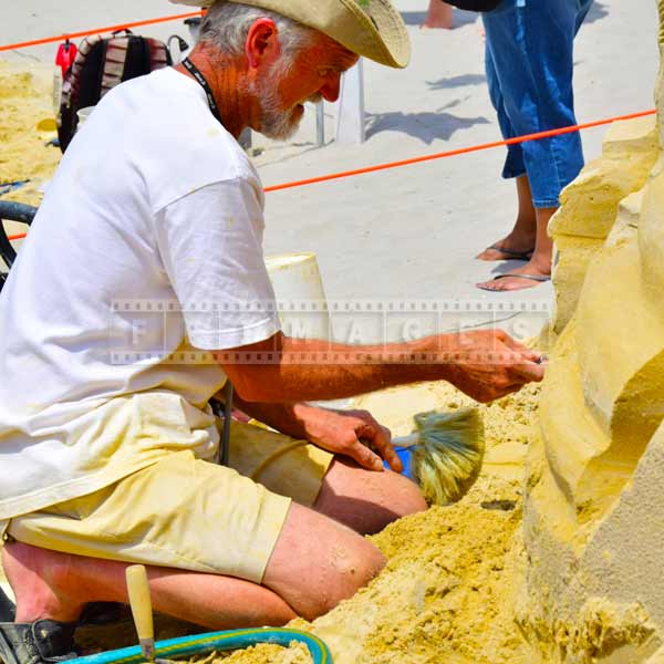 Canadian sand artist Peter Vogelaar creates his sand sculpture 