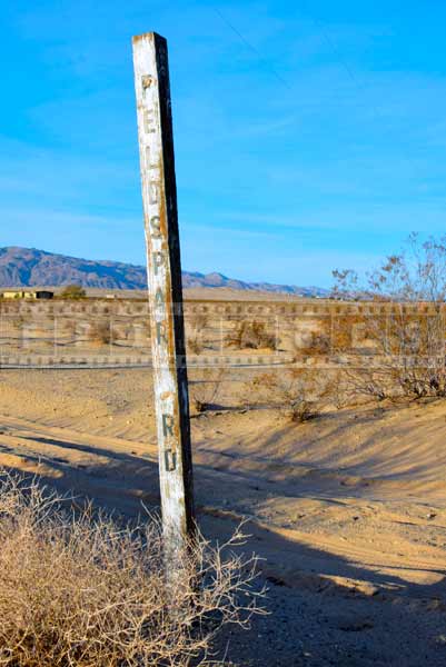 Sand street name wooden post fading, travel images