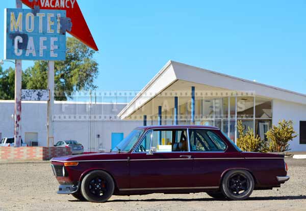 Retro motel sign and BMW 2002, route 66 California