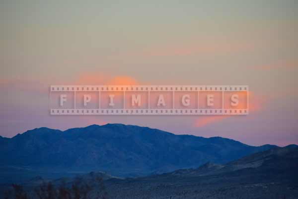 Desert landscape with pink clouds and mountains, Mojave desert travel images