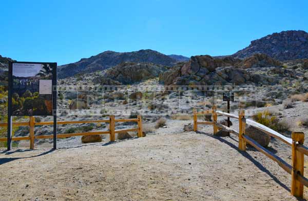 Information board and fence at the entrance to the hike, plan a trip