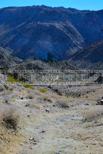 Descending to the oasis amid desert and mountains, travel images