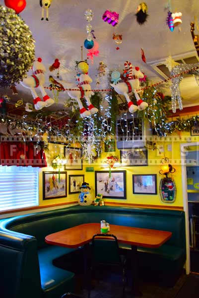 Evergreen cafe corner table and holiday decorations