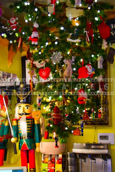 Christmas tree hanging upside down from the ceiling and nutcrakcer figurine