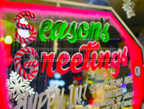 Season's greetings store window decorations