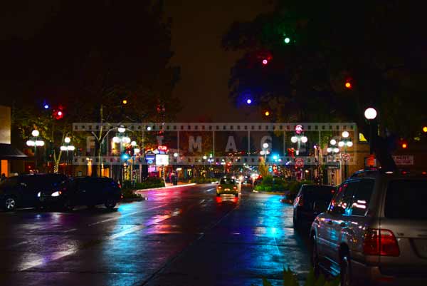 Night reflections of street and holiday decorations