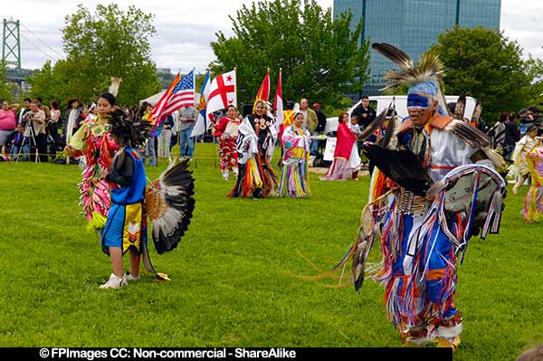 Male and female dancers at the start of powwow in Dartmouth