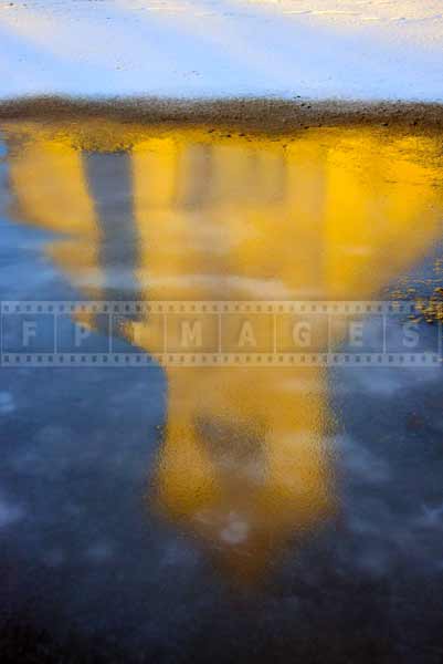 Morning reflections of the church in the ice - abstract art picture