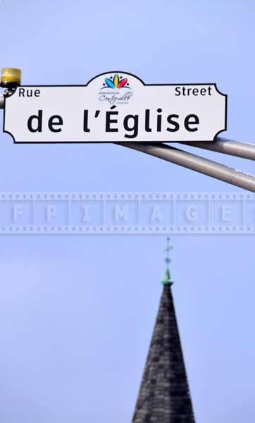 de l'Eglise street sign and church spire, Edmundston cityscape