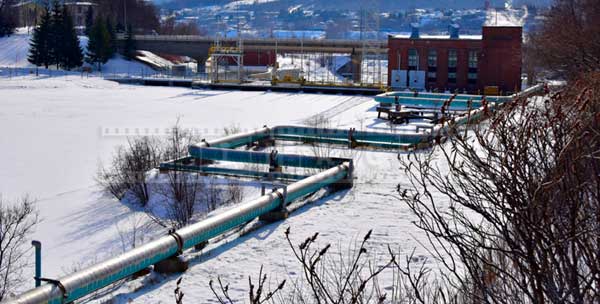 Pipeline near Madawaska river, industrial winter pictures