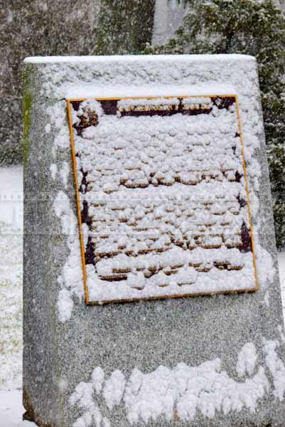 snow covered memorial plaque