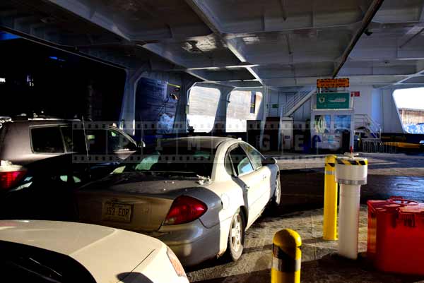 cars parked on open car deck of the ferry