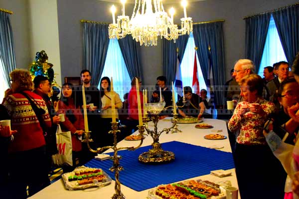 Visitors around the table with snacks