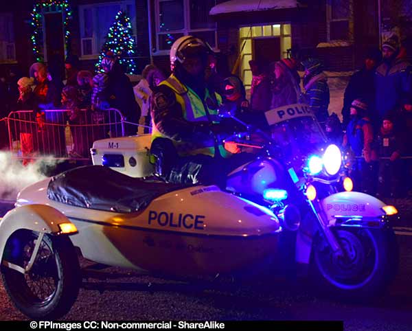 Police bikes open the night parade