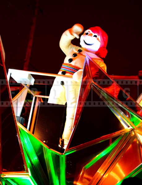 Bonhomme waving to the crowd at Quebec winter night parade