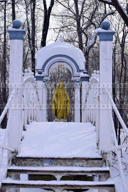 Nice curved bridge and virgin Mary statue