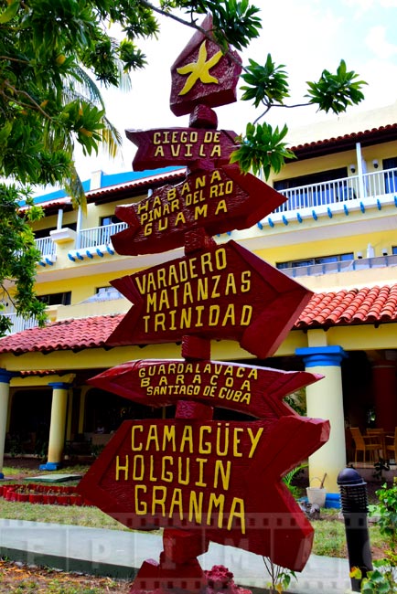 Colorful sign pointing to major Cuban cities