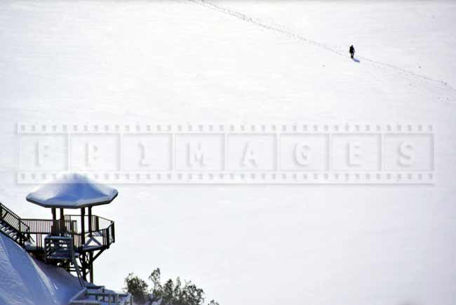 Winter picture of a panoramic stairway lookout and a person hiking