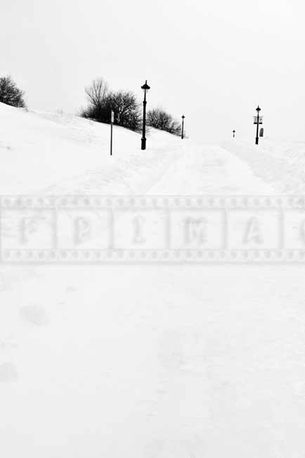 Snow covered winter trail for hiking or walking