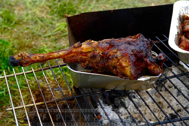 Grilled drumstick over the charcoals