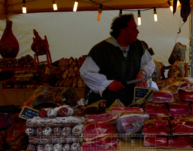 Farmer with the knife at the meat stand