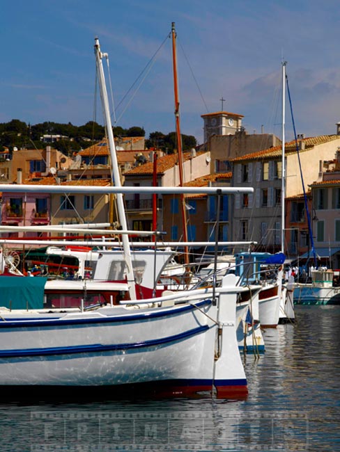 White and blue boats moored in Cassis harbour