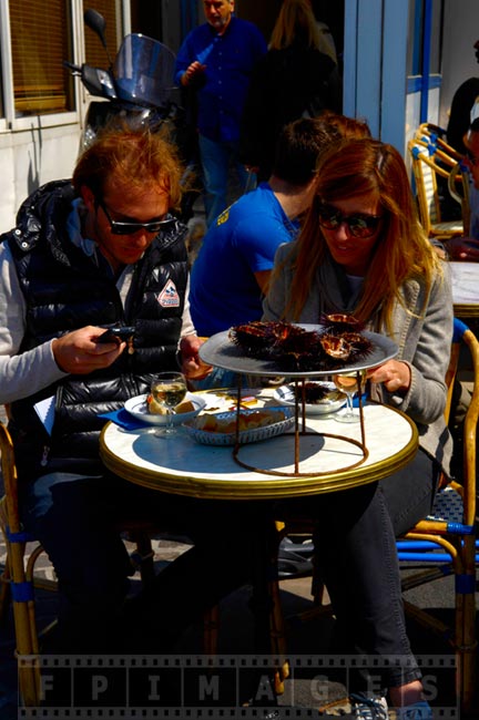 Tourists eating live sea urchins