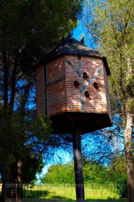 Brick birdhouse in the forest