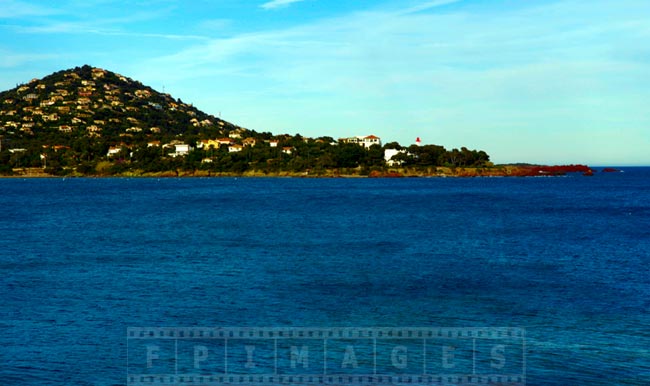 Hill and lighthouse at the entrance to the bay