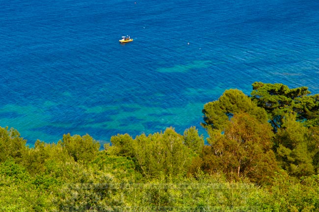 Seascape with small boat, view from above