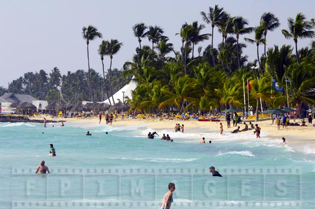 Tourists enjoying the warm ocean in La Romana