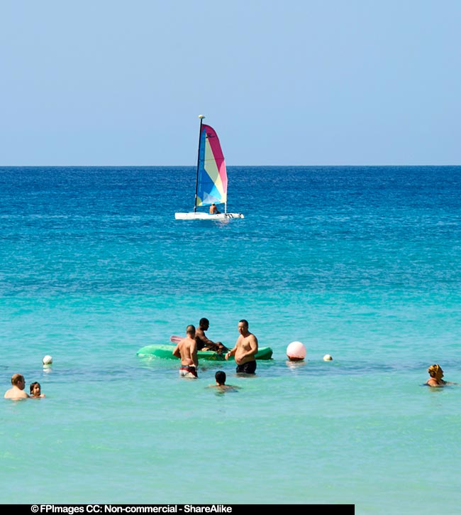 People enjoying the beach in La Romana