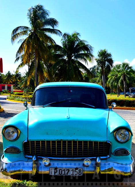 Old car of turquoise color just like Caribbean sea, 1950-s Chevrolet