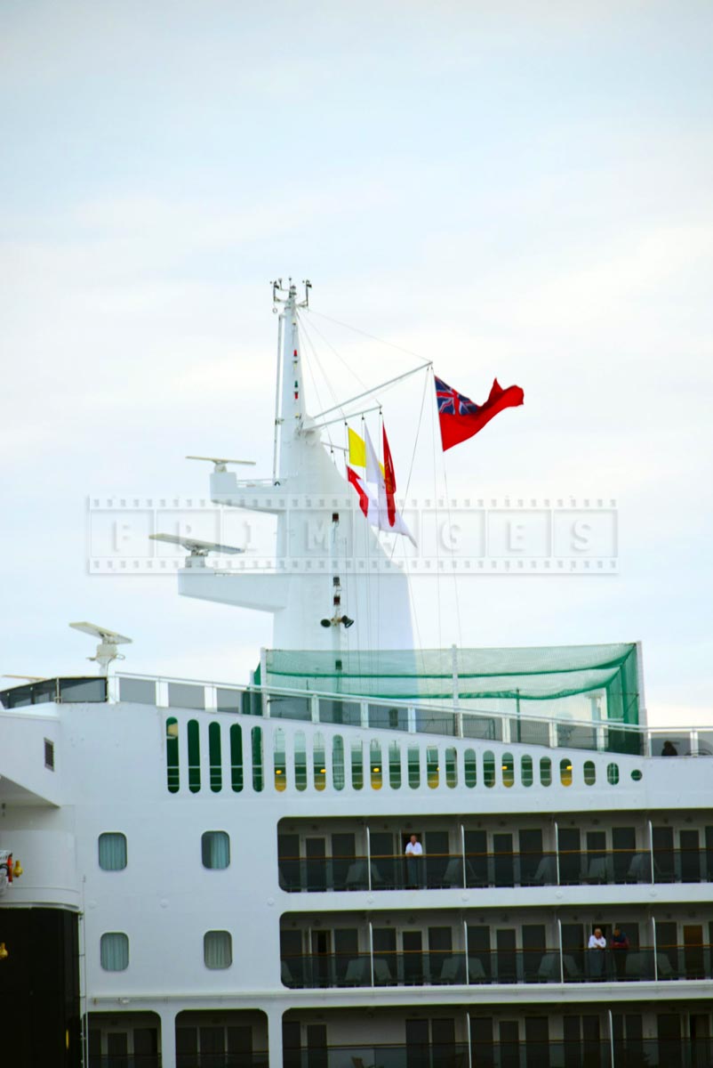 Flags flying on the main mast of QM2