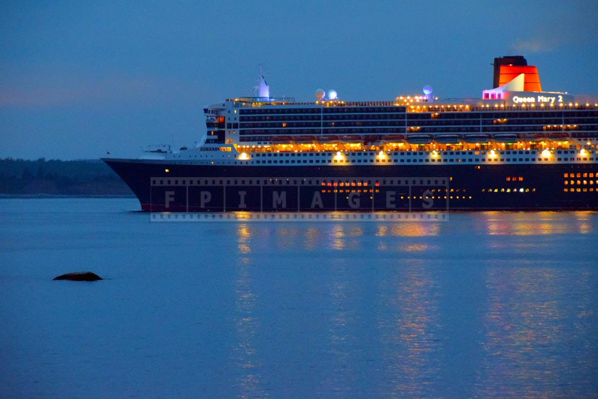 RMS Queen Mary 2 at morning dusk with lights, Halifax, NS