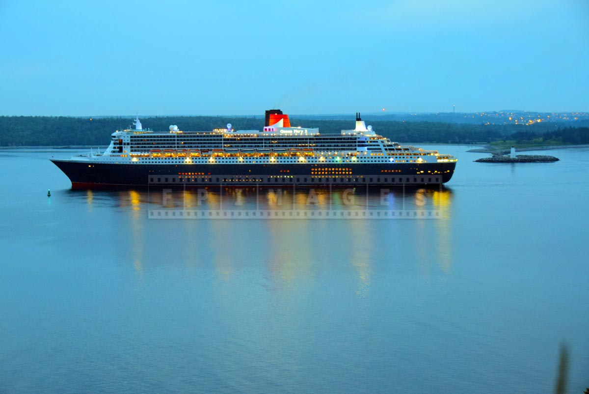 Elegant cruise liner Queen Mary 2 passes McNabs island and Maugher beach lighthouse