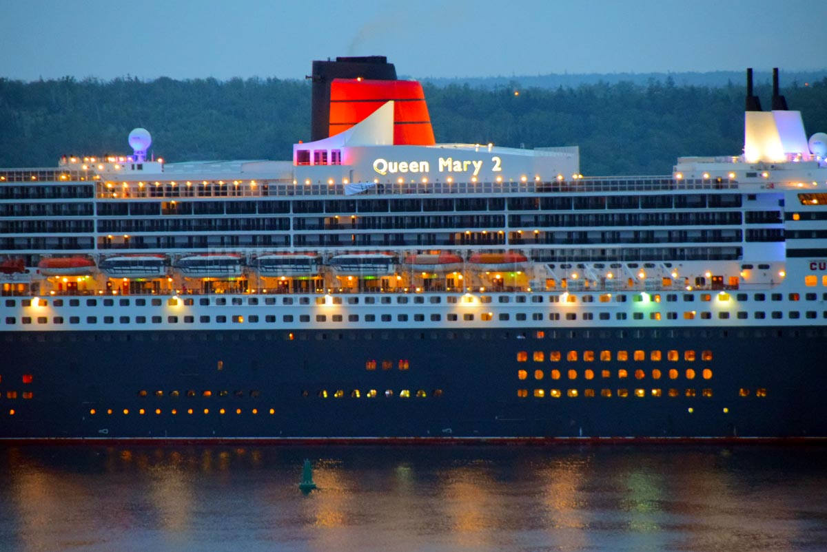 Iconic Cunard Line orange smoke stack with black lines, QM2 cruise ship