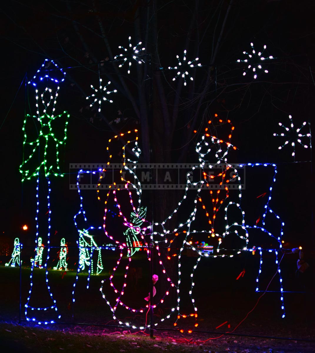 Romantic scene with a couple and snowflakes - holiday lights