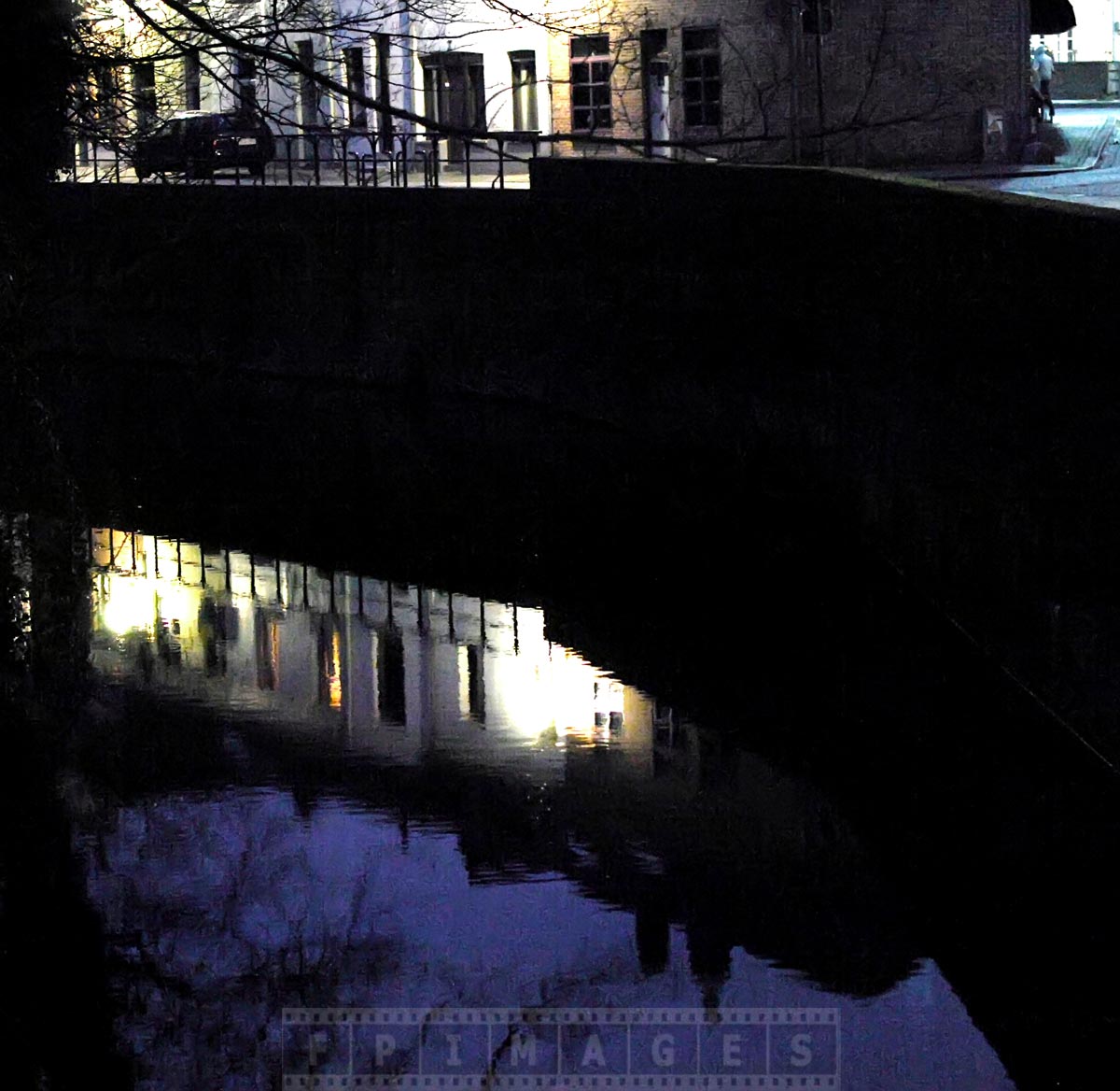 Bruges canal at night is quiet and peaceful