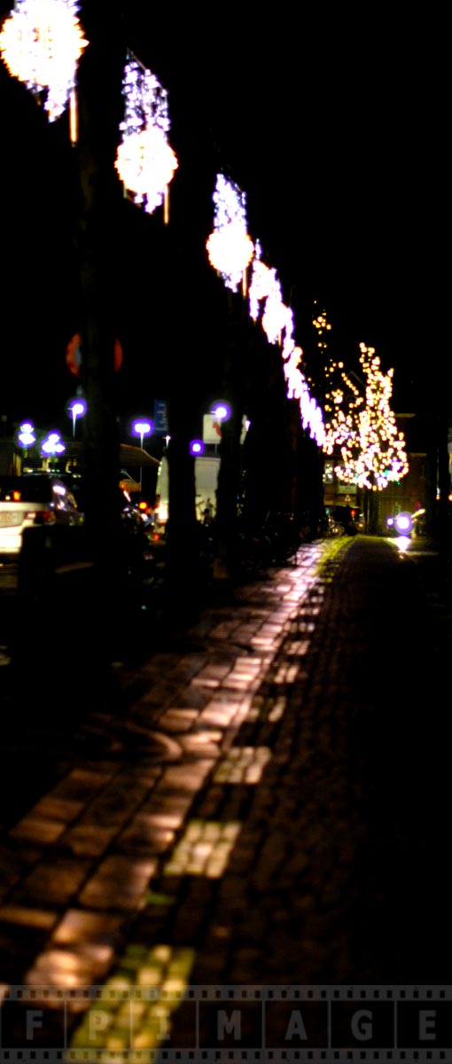 Romantic old cobble streets at night in Bruges, Belgium