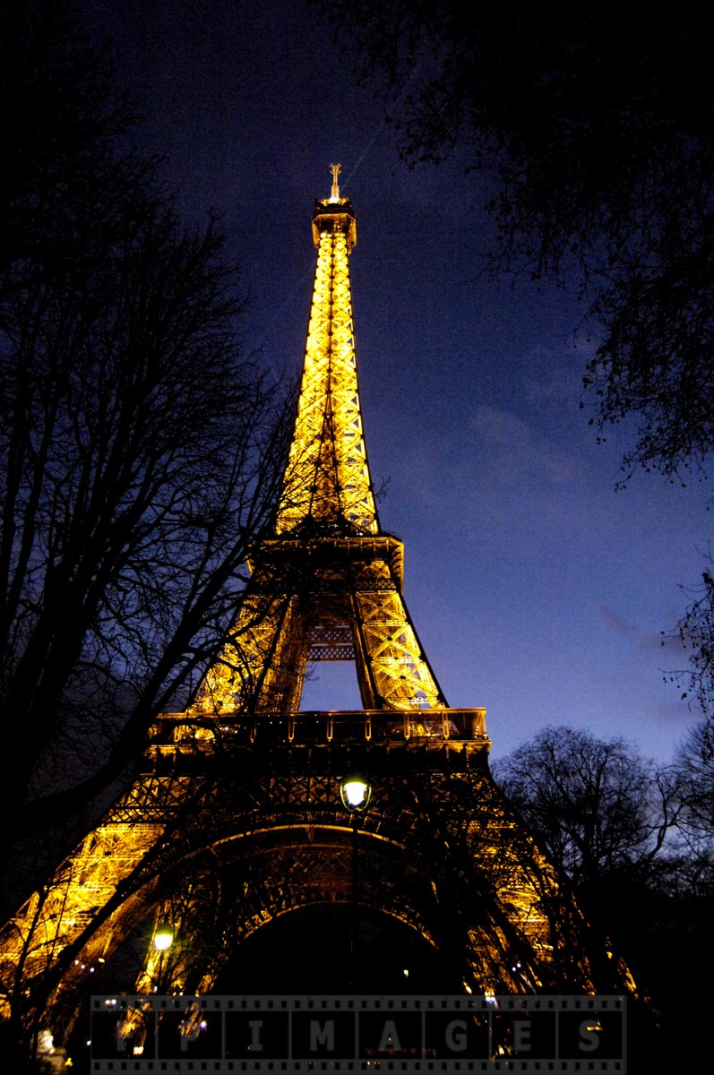 Tour Eiffel Tower at dusk with bright lights - most magic sight in Paris