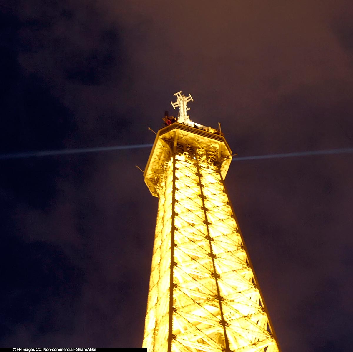 Eiffel Tower lit up at night is especially elegant and delightful