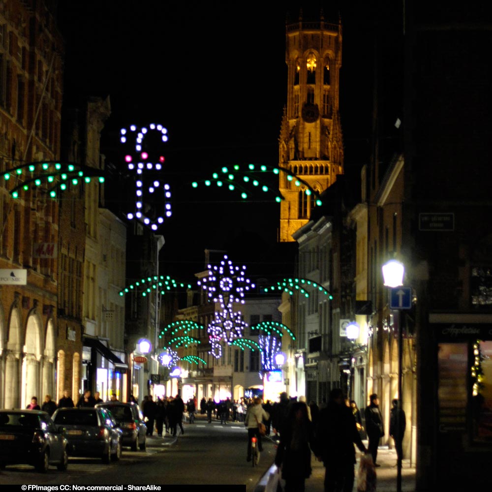 Bruges Belfry building at night and cobble streets